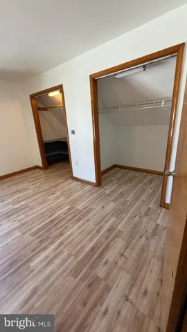 a view of a play room with furniture and toys