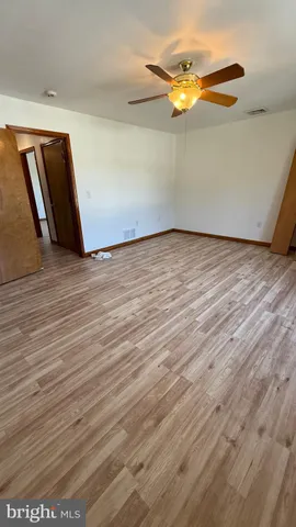 a kitchen with stainless steel appliances kitchen island granite countertop a stove and a sink