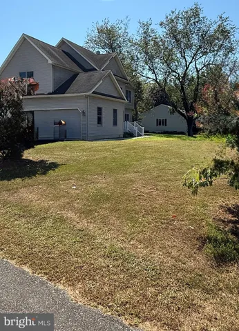 a kitchen with granite countertop a stove a sink and a microwave