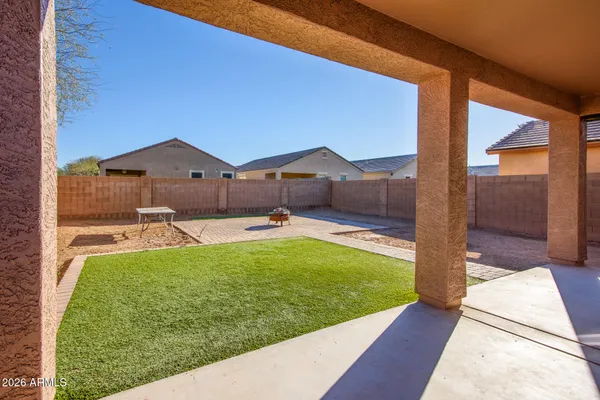 a view of a house with a yard porch and sitting area