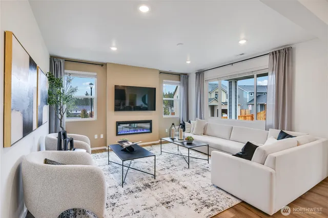 a living room with furniture and a large window