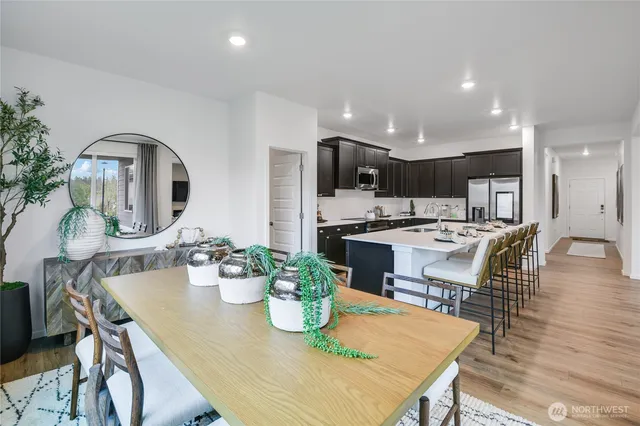 a view of a patio with couches chairs and floor to ceiling window