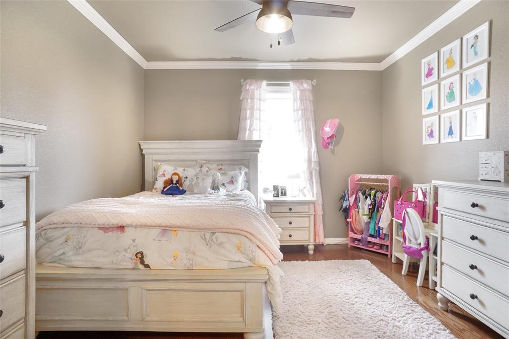 13340 John Day Road Haslet, TX 76052 - Photo 17 of 30 a bedroom with a bed and a dresser