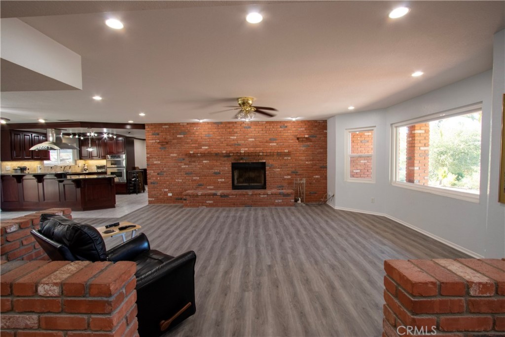 17595 Rancho De La Angel Road Ramona, CA 92065 - Photo 17 of 63 a living room with furniture and a fireplace