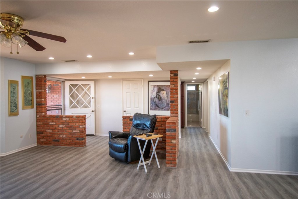 17595 Rancho De La Angel Road Ramona, CA 92065 - Photo 20 of 63 a view of a dining room with furniture and wooden floor