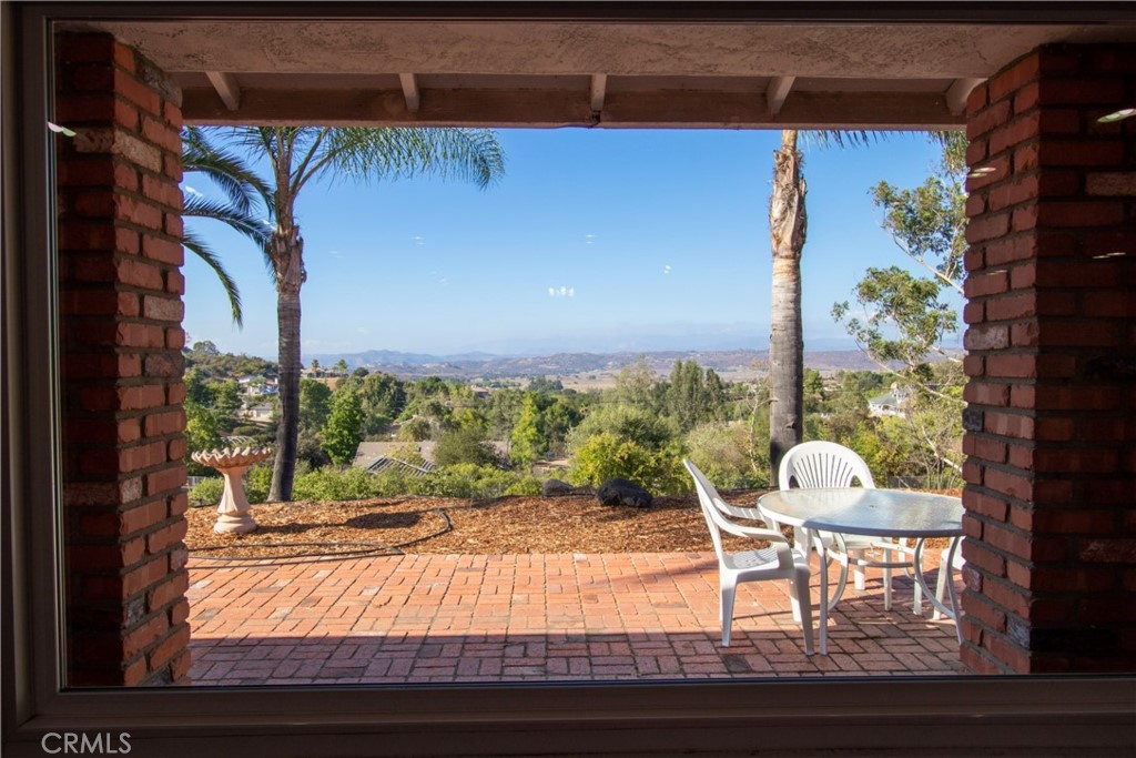 17595 Rancho De La Angel Road Ramona, CA 92065 - Photo 22 of 63 a view of a room with a large window and table and chairs