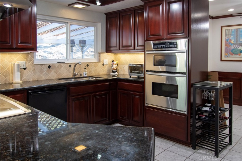 17595 Rancho De La Angel Road Ramona, CA 92065 - Photo 26 of 63 a kitchen with a sink and cabinets