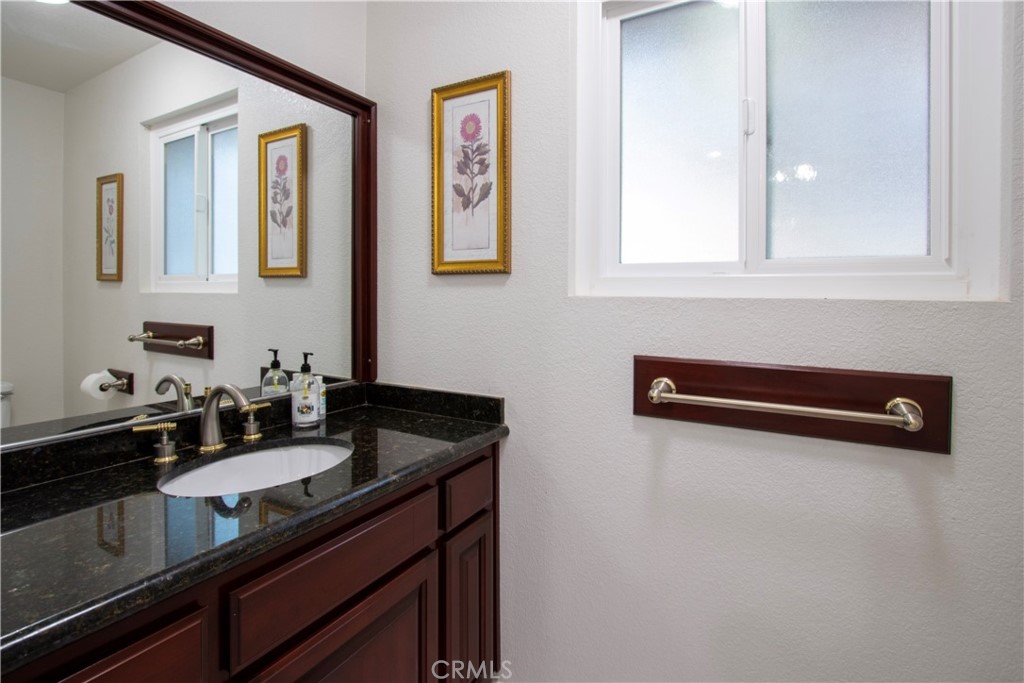 17595 Rancho De La Angel Road Ramona, CA 92065 - Photo 34 of 63 a bathroom with a sink and a mirror
