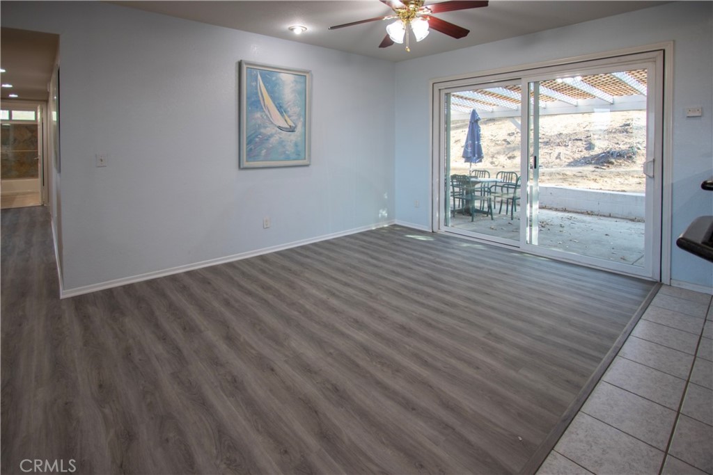 17595 Rancho De La Angel Road Ramona, CA 92065 - Photo 45 of 63 an empty room with wooden floor and windows