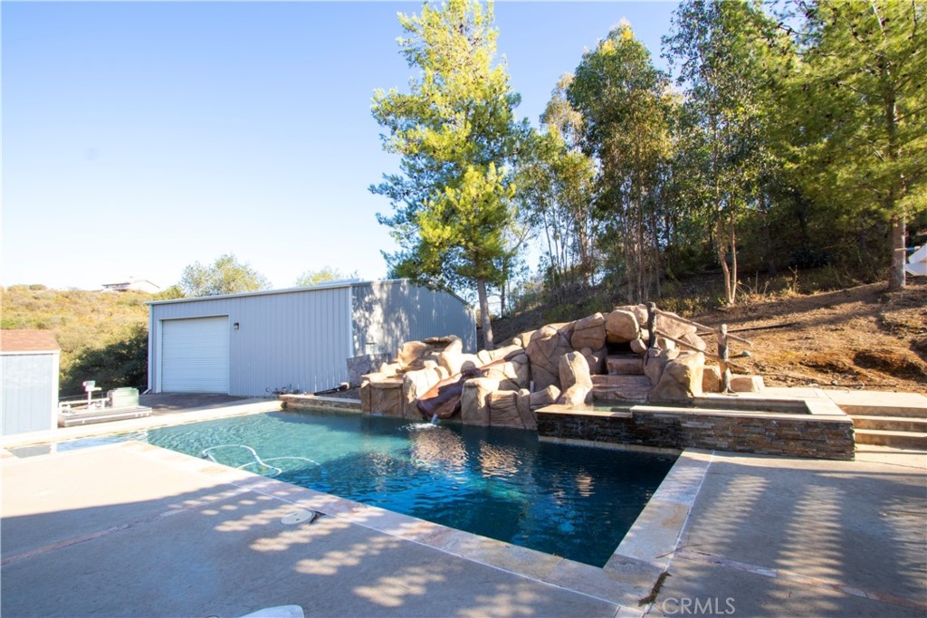 17595 Rancho De La Angel Road Ramona, CA 92065 - Photo 49 of 63 a view of a lake with a house