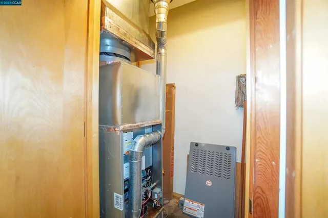 a bathroom with a toilet sink vanity and a shower