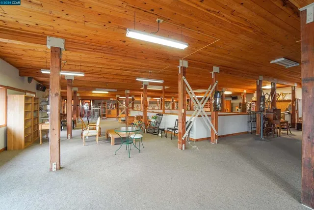 a view of a balcony with chairs and with furniture