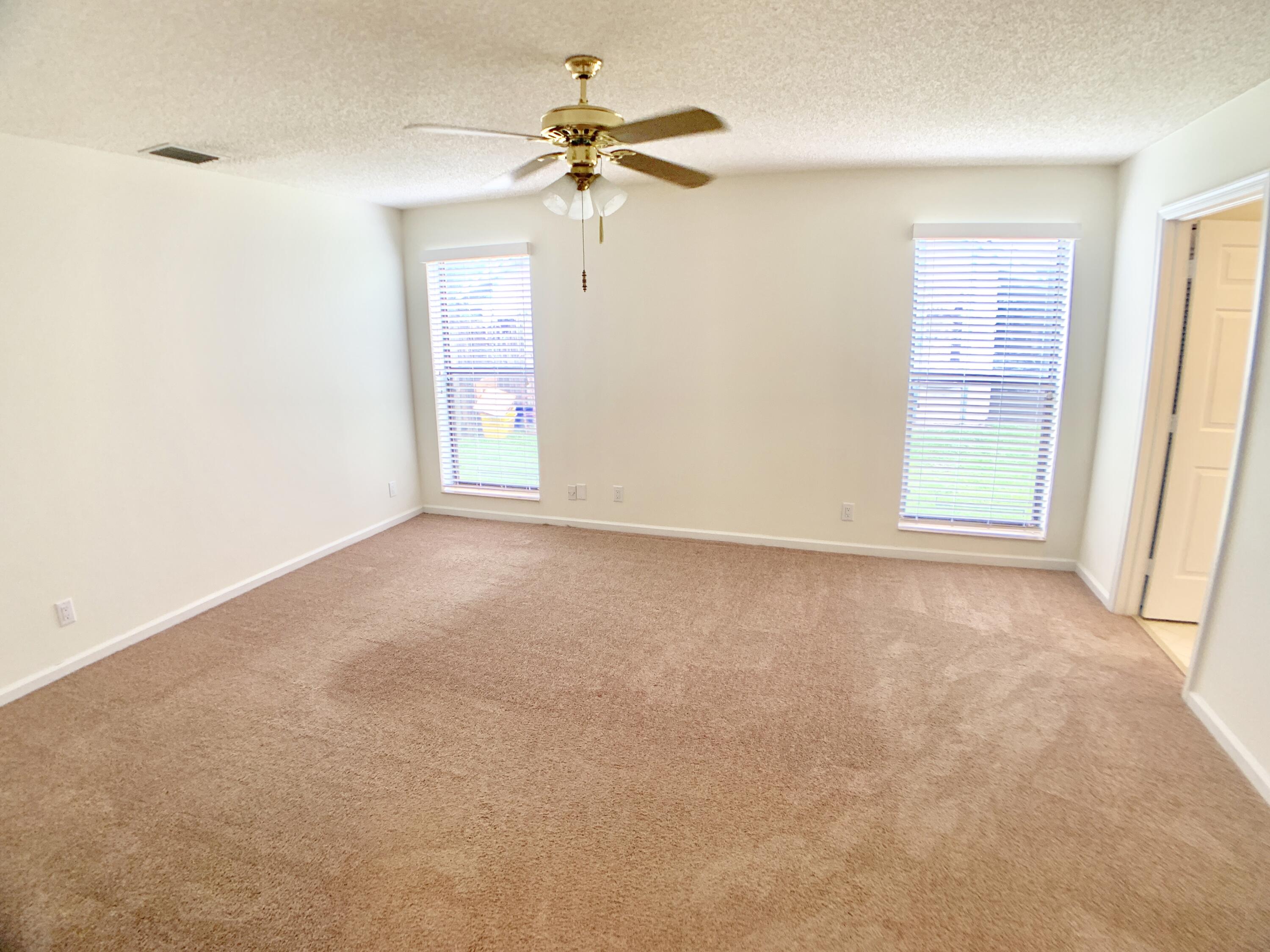 1242 Raintree Lane Wellington, FL 33414 - Photo 11 of 36 Primary Bedroom