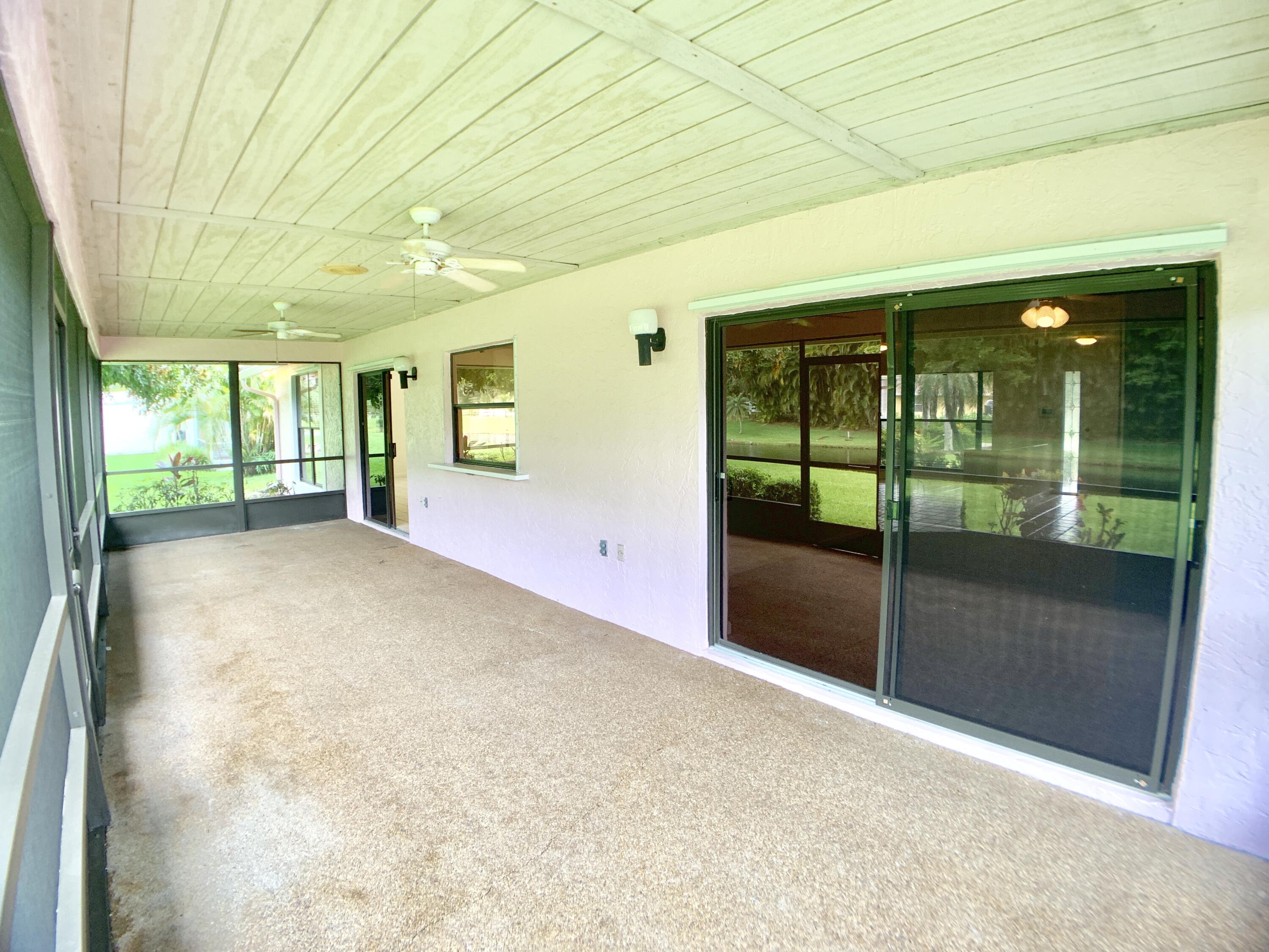 1242 Raintree Lane Wellington, FL 33414 - Photo 28 of 36 Back Patio