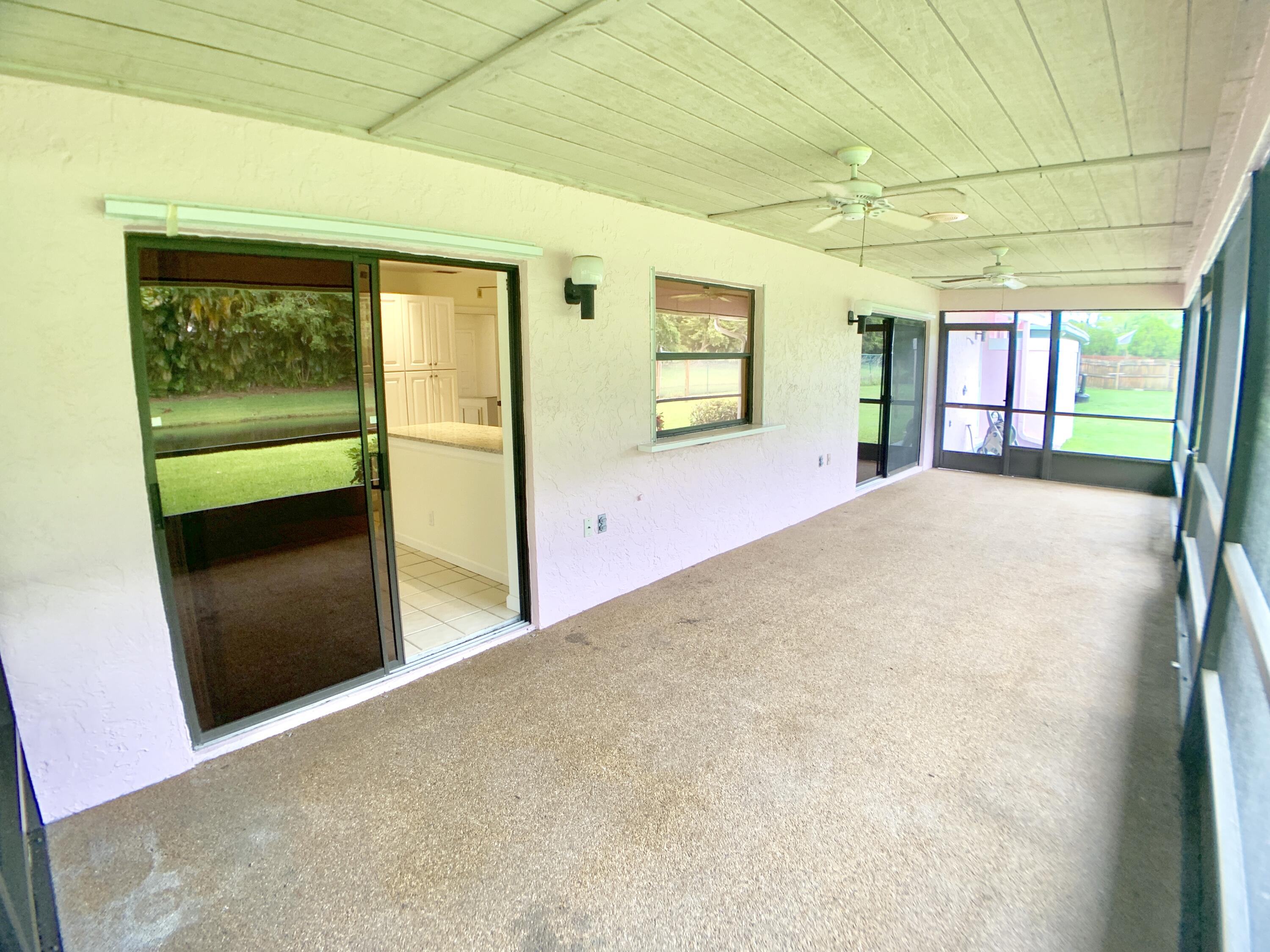 1242 Raintree Lane Wellington, FL 33414 - Photo 33 of 36 Back Patio