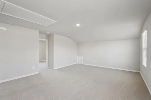 an empty room with a empty space and windows