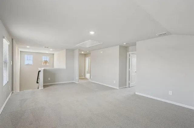 a view of a livingroom and a kitchen