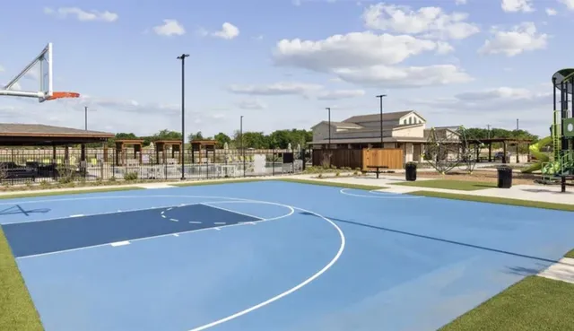 a view of a swimming pool with a lawn chairs
