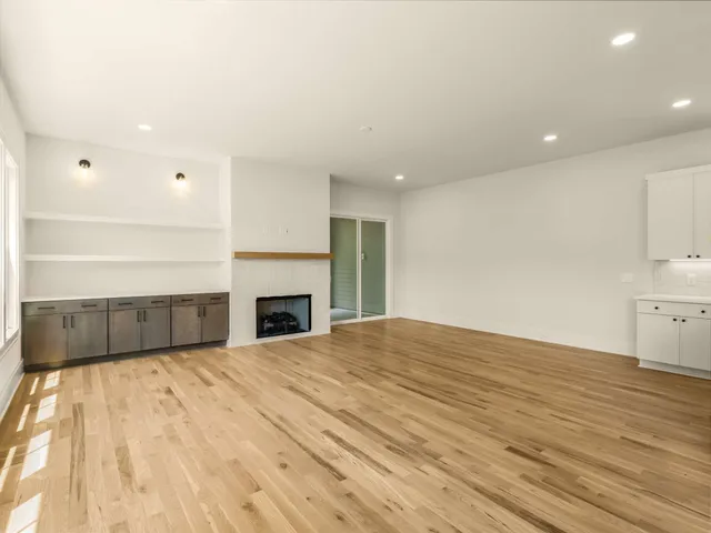 a view of storage and utility room with wooden floor