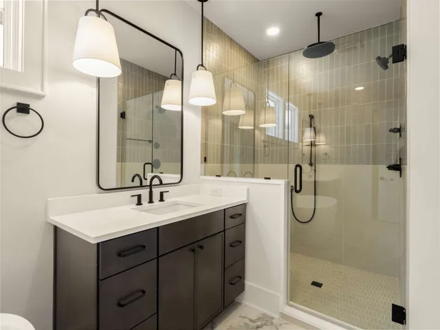 a view of a room with wooden floor and white walls