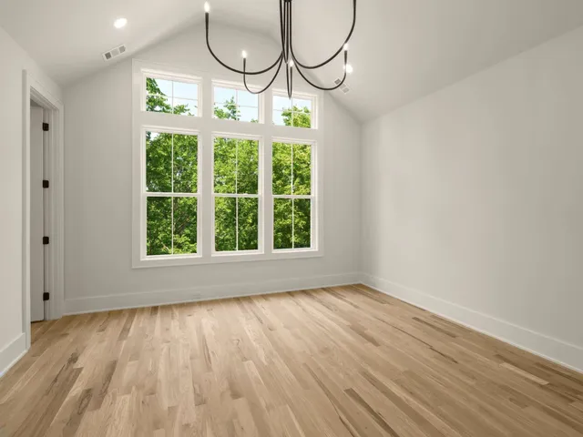 a view of an empty room with windows