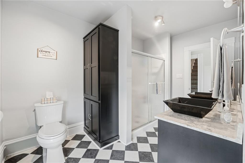 519 West Ridge Avenue Sharpsville, PA 16150 - Photo 26 of 48 a bathroom with a sink a toilet a shower and mirror