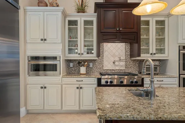 a living room with furniture a flat screen tv and a large window