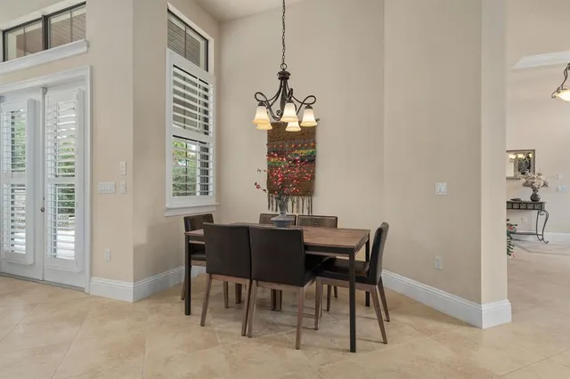 a bedroom with bed and wooden floor