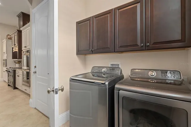 a spacious bathroom with a granite countertop tub a sink and a large mirror