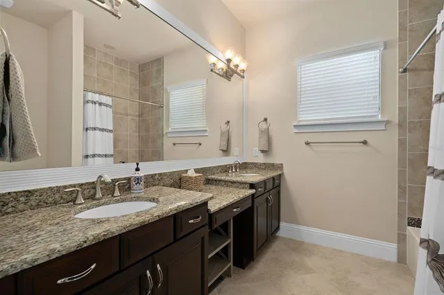 a bed room with a bed and a window