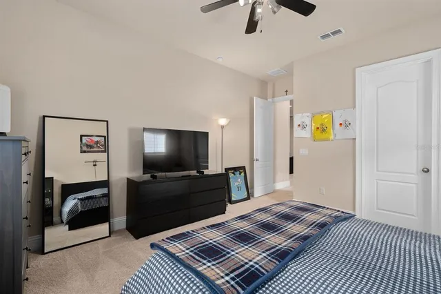 a view of a chairs and table in the back yard