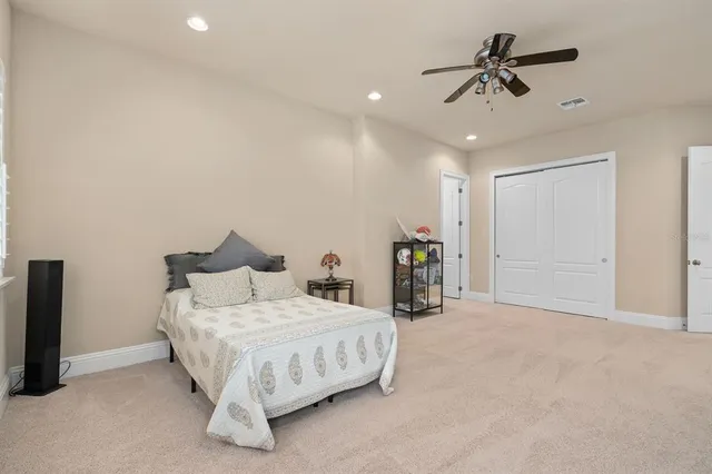 an aerial view of a city with lots of residential buildings ocean and mountain view in back