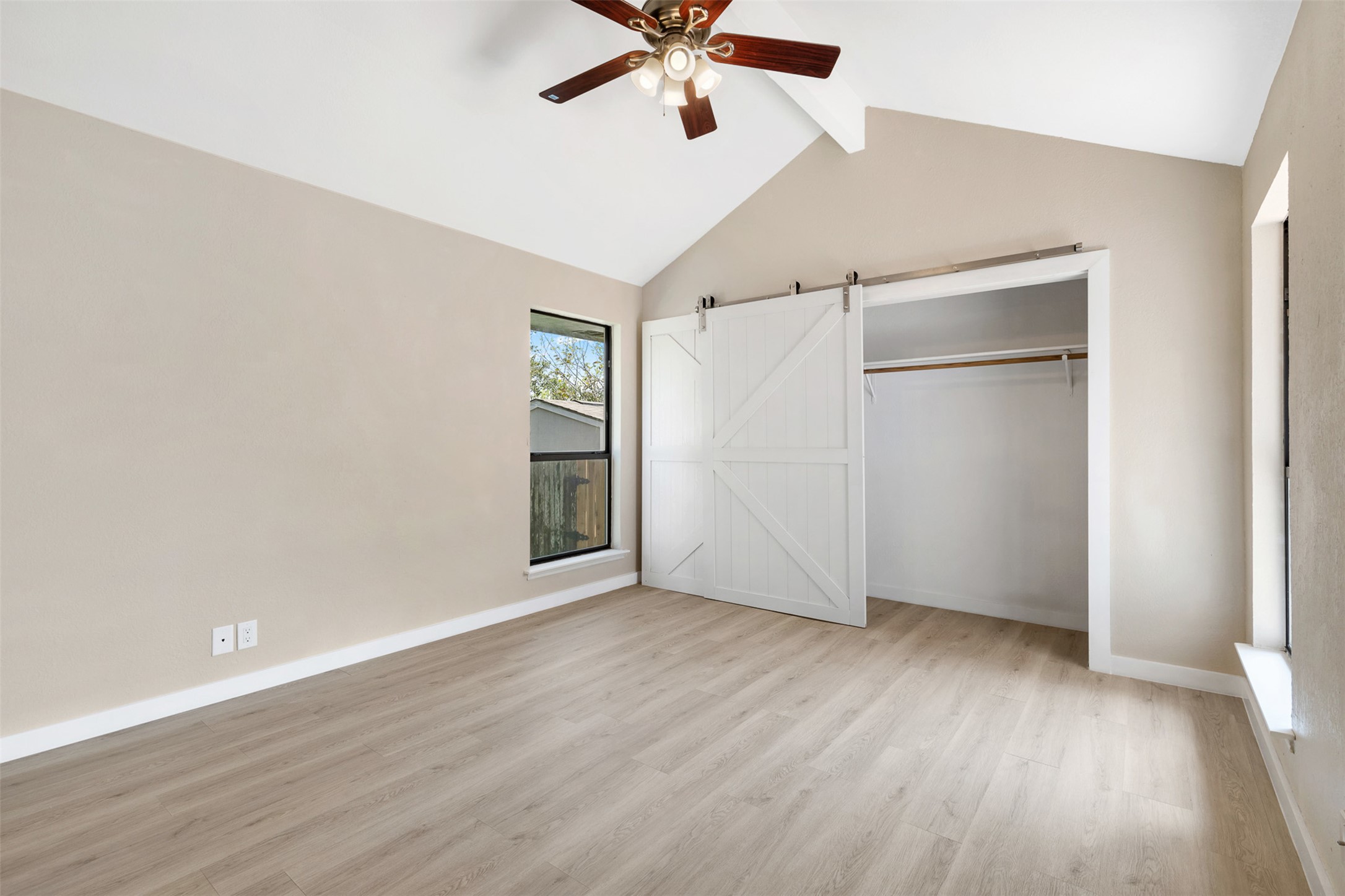 3203 Freemont Street Round Rock, TX 78681 - Photo 12 of 33 wooden floor in an empty room with a window