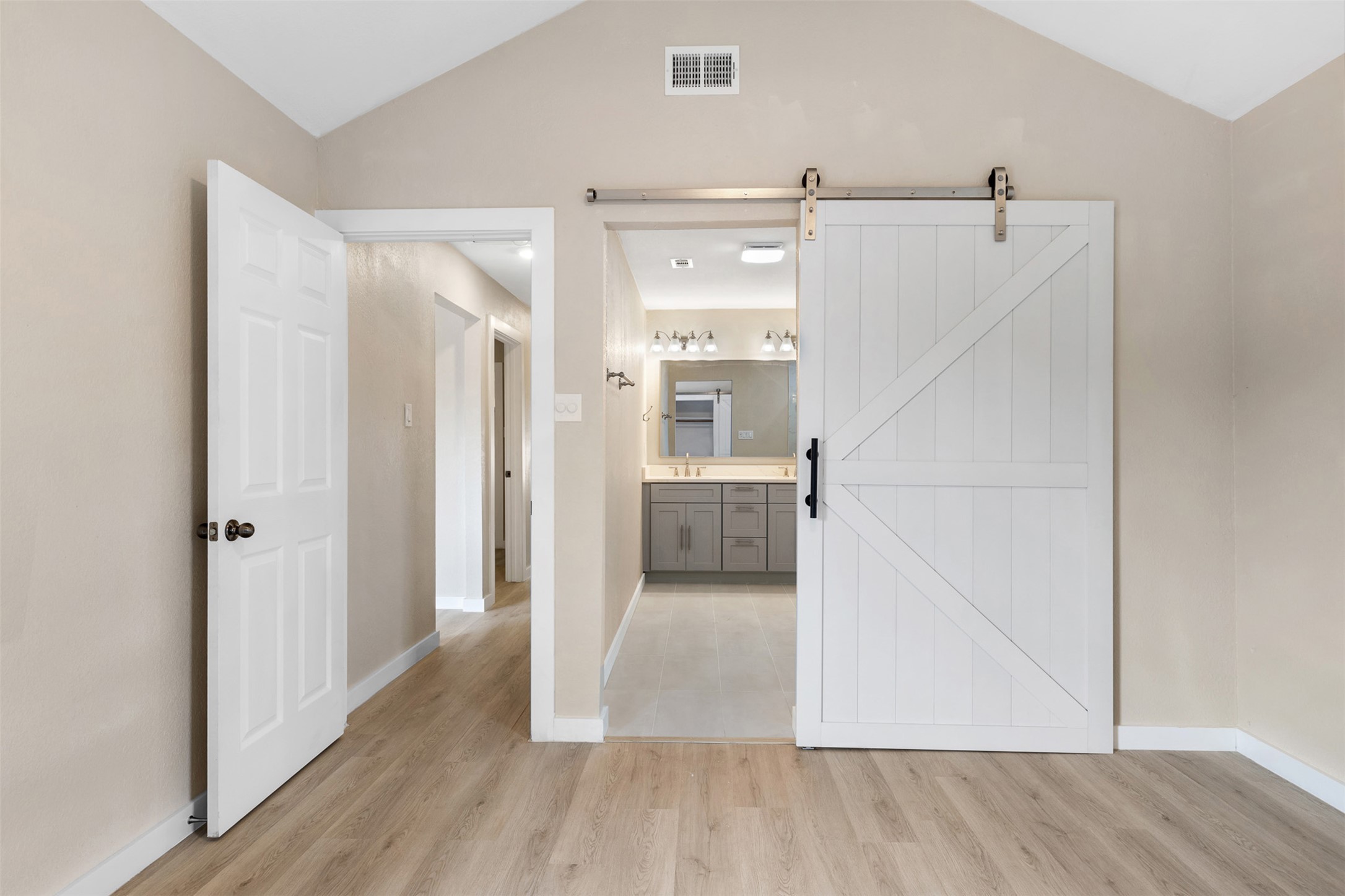 3203 Freemont Street Round Rock, TX 78681 - Photo 13 of 33 a view of a hallway view with wooden floor and electronic appliances