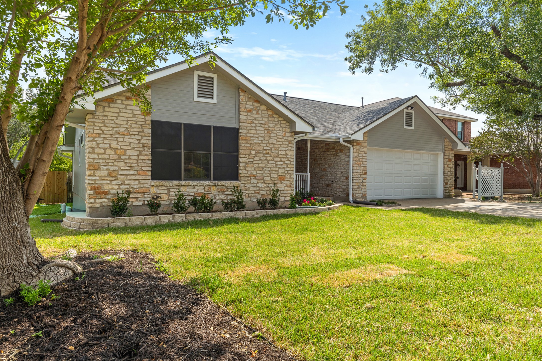 3203 Freemont Street Round Rock, TX 78681 - Photo 3 of 33 a front view of house with yard and trees in the background