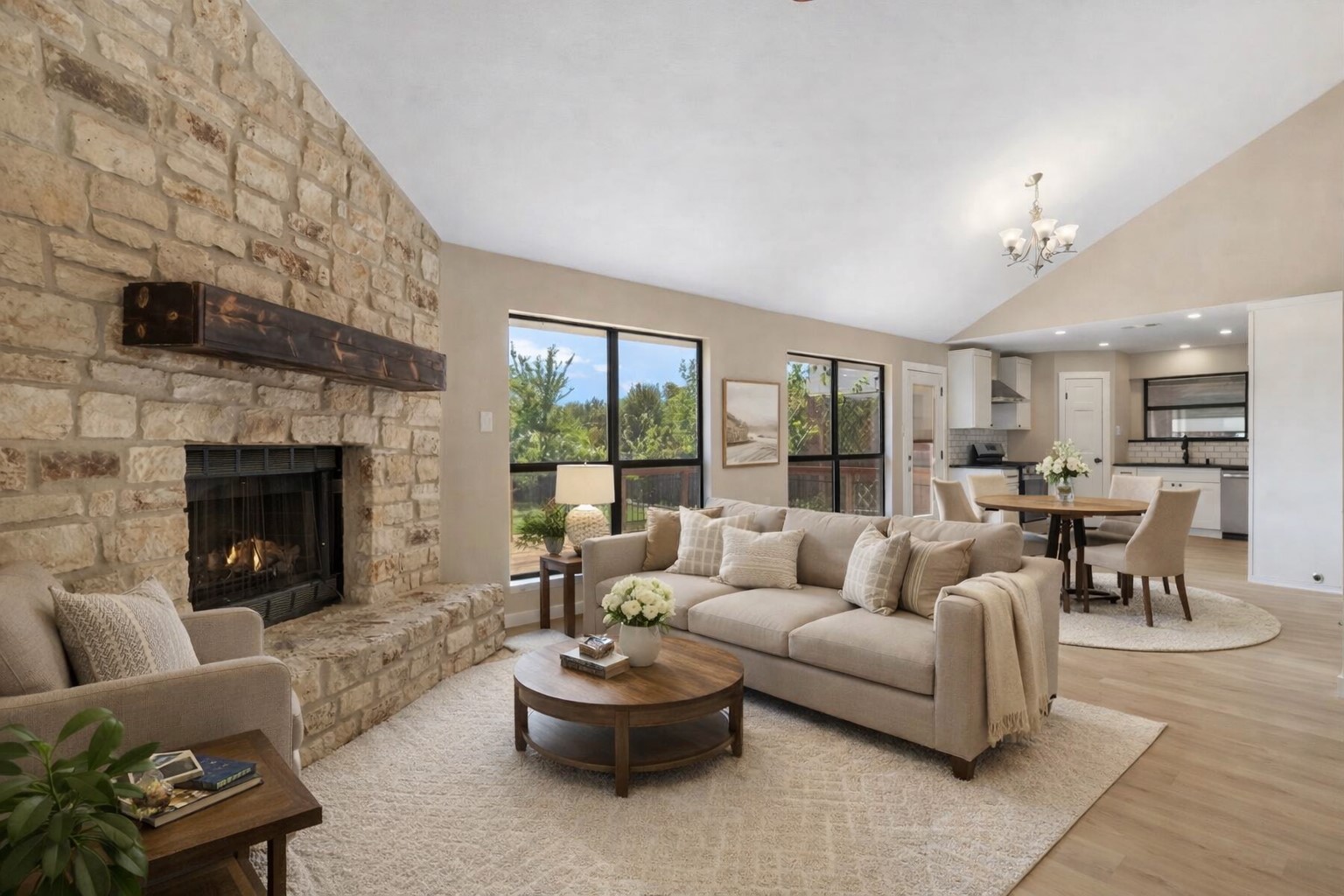3203 Freemont Street Round Rock, TX 78681 - Photo 32 of 33 a living room with furniture a fireplace and a floor to ceiling window