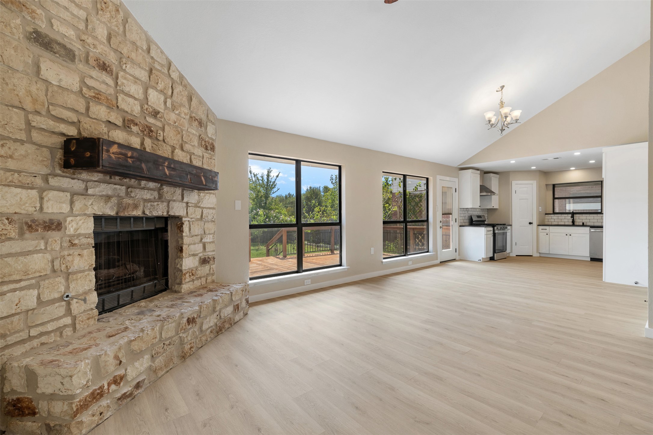 3203 Freemont Street Round Rock, TX 78681 - Photo 6 of 33 a view of empty room with wooden floor and fireplace