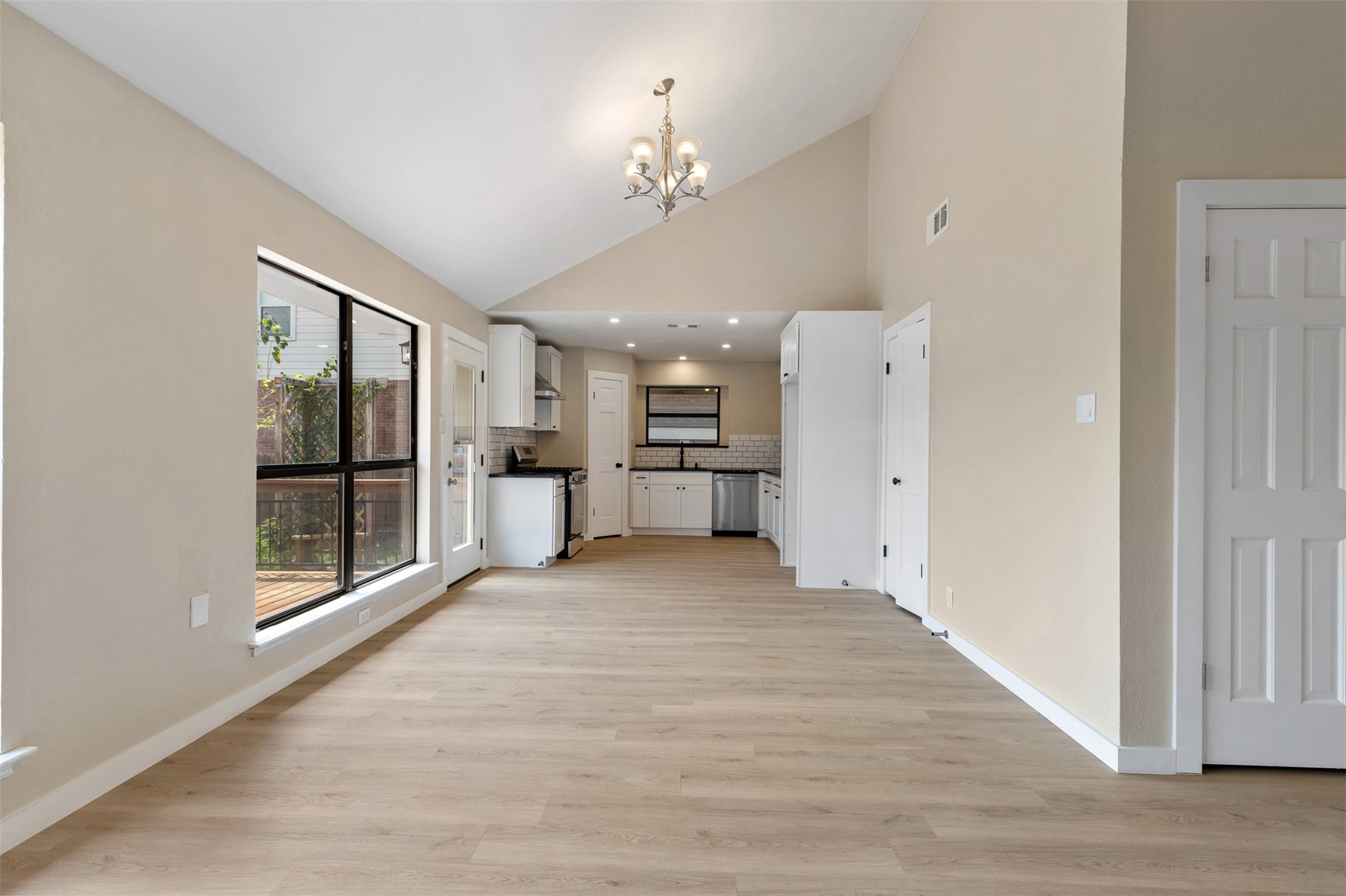 3203 Freemont Street Round Rock, TX 78681 - Photo 7 of 33 a view of an empty room with a kitchen