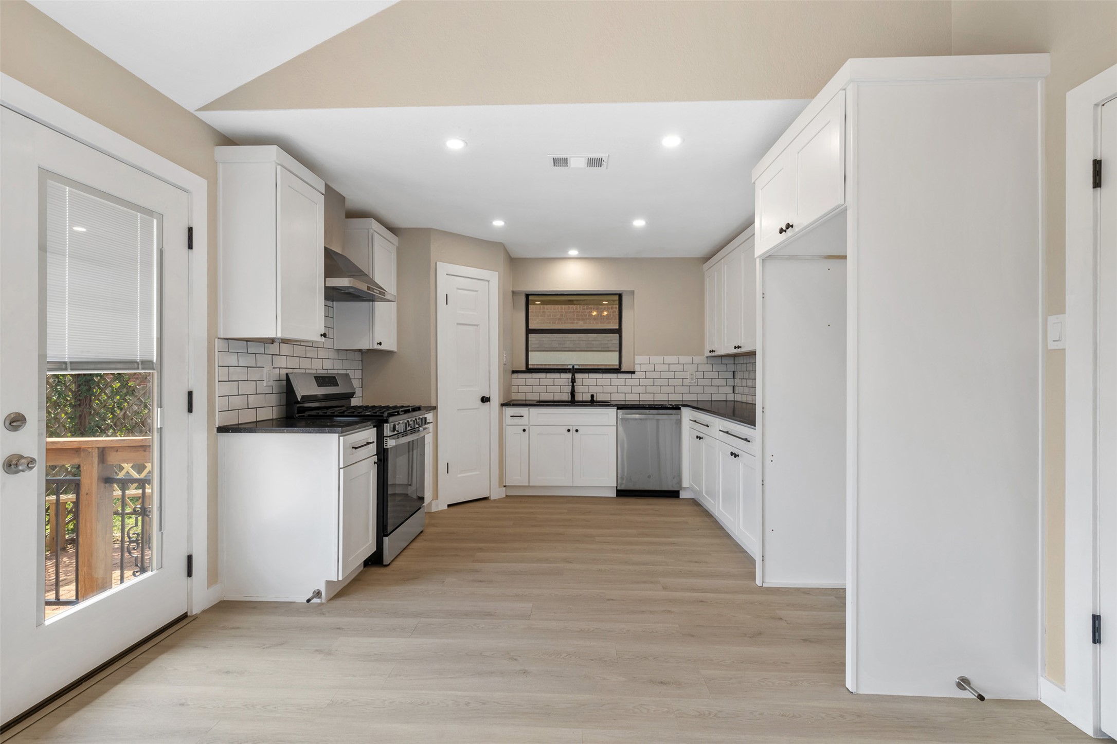 3203 Freemont Street Round Rock, TX 78681 - Photo 8 of 33 a large kitchen with cabinets and stainless steel appliances