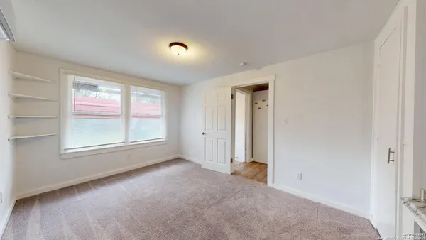 an empty room with windows