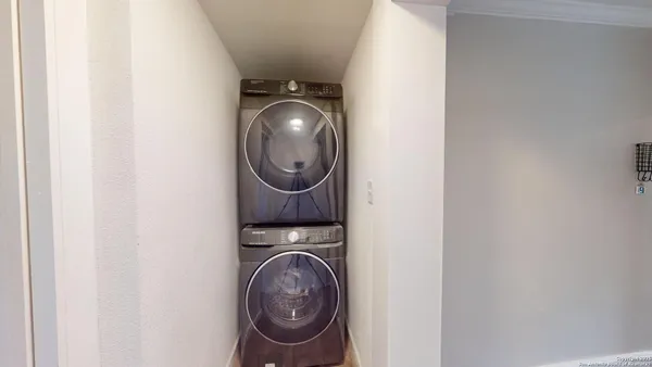 a close view of a utility room with dryer and washer
