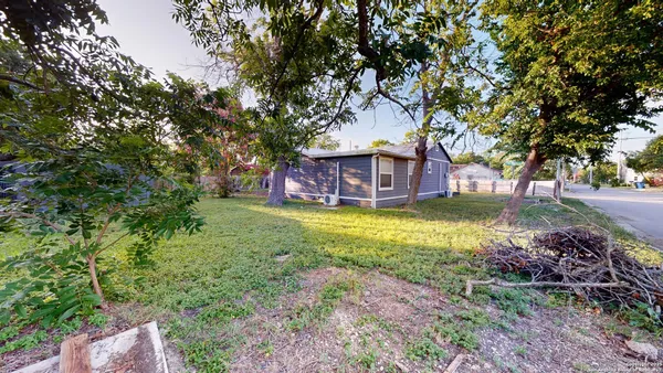 front view of a house with a big yard