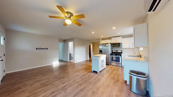 a view of a kitchen with microwave and a stove