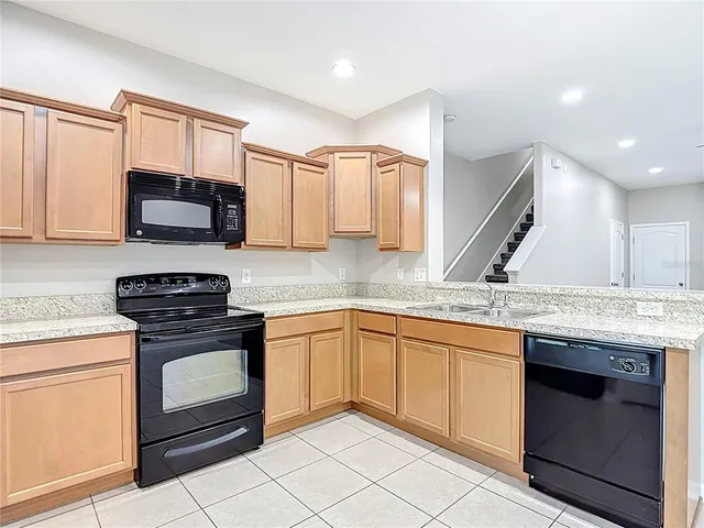 a bathroom with a double vanity sink toilet and a mirror