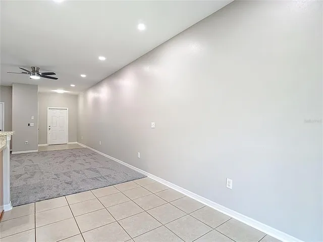 front view of a brick house with a yard