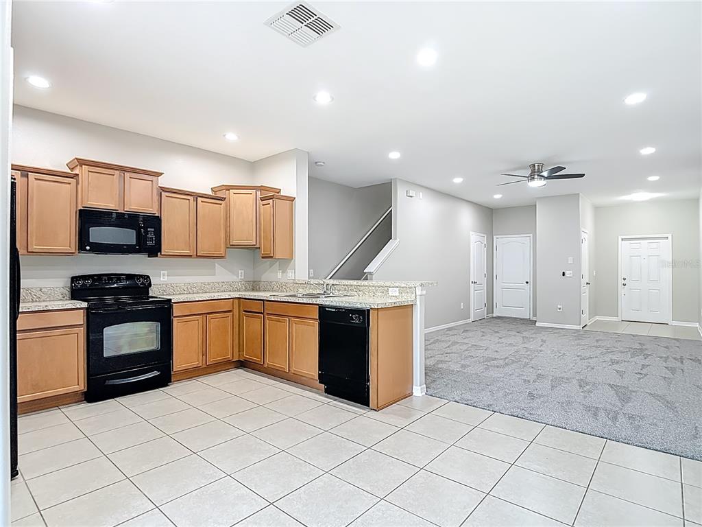 20451 Berrywood Lane Tampa, FL 33647 - Photo 23 of 57 a large kitchen with a sink and stainless steel appliances