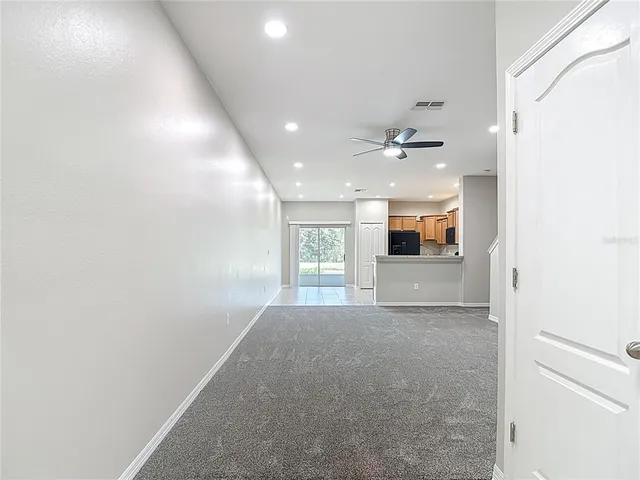 a kitchen with stainless steel appliances a refrigerator sink and microwave