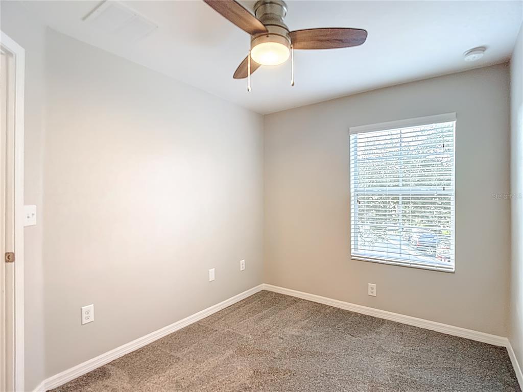 20451 Berrywood Lane Tampa, FL 33647 - Photo 41 of 57 an empty room with a window and a fan