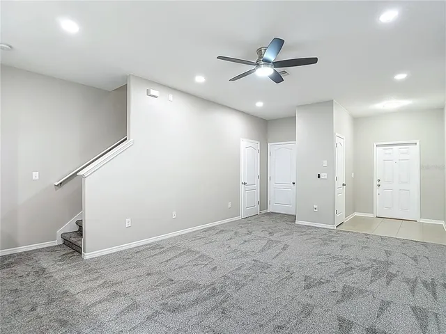 a kitchen with granite countertop a sink and cabinets