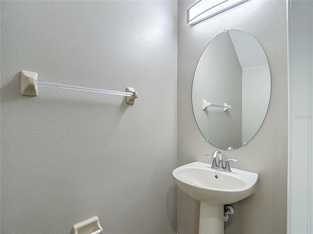 20451 Berrywood Lane Tampa, FL 33647 - Photo 8 of 57 a bathroom with a sink a mirror and vanity
